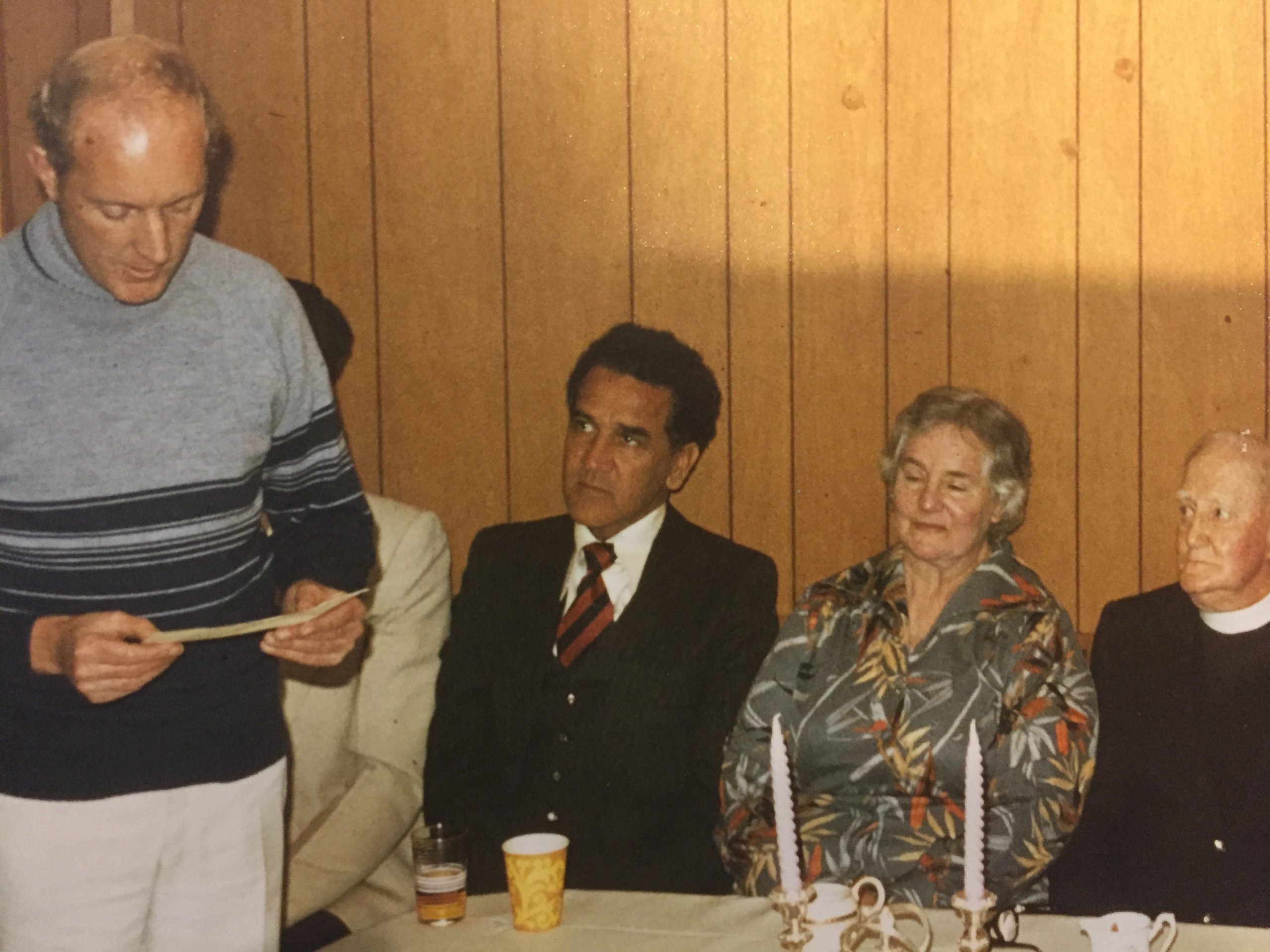 John P McD Smith with Charles Perkins AO, (Bill Espie – obscured), Isabel and Percy Smith at a gathering to celebrate Percy’s award from Queen Elizabeth II in the 1980 Queen’s Birthday Honours
