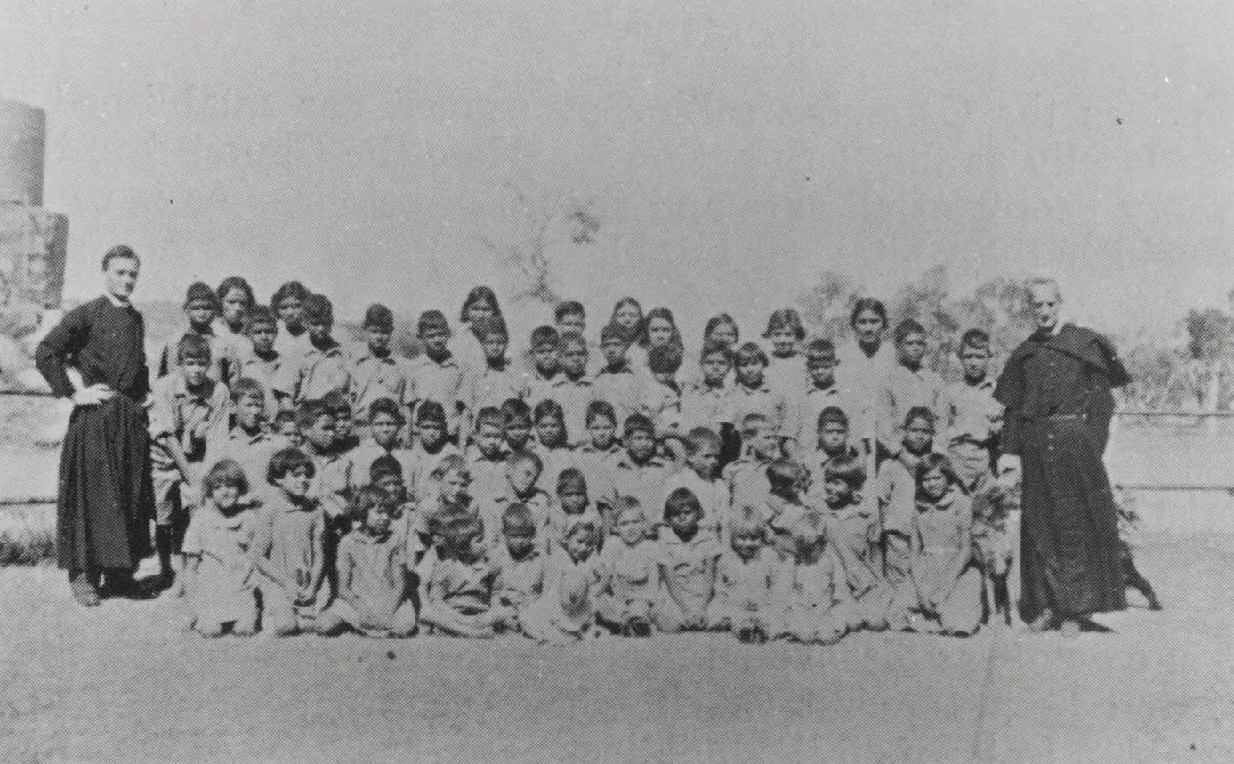 1937- Anglican Children Group with Fr Ken Leslie & Fr Percy Smith at ‘The Bungalow’ Alice Springs